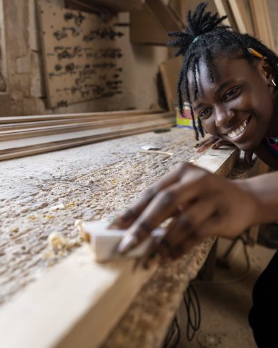 carpenter-cutting-mdf-board-inside-workshop